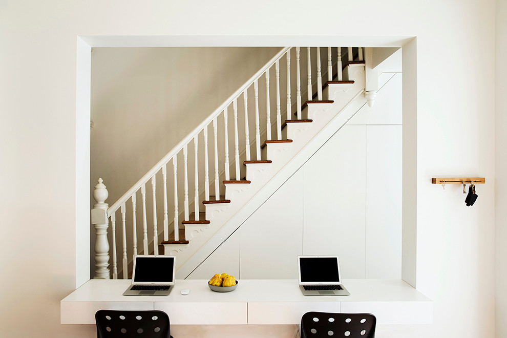 This is an example of a contemporary wood straight staircase in Sydney with wood risers.