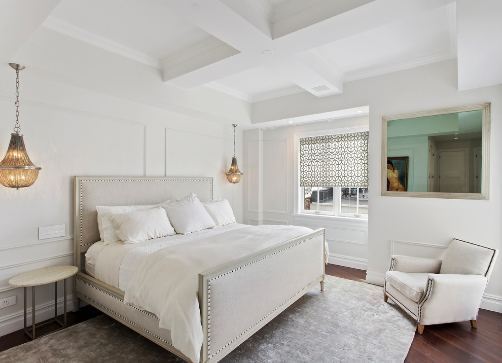 Transitional bedroom in New York with white walls and dark hardwood floors.