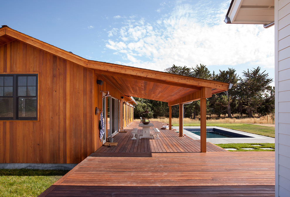This is an example of a mid-sized country backyard deck in San Francisco with no cover.