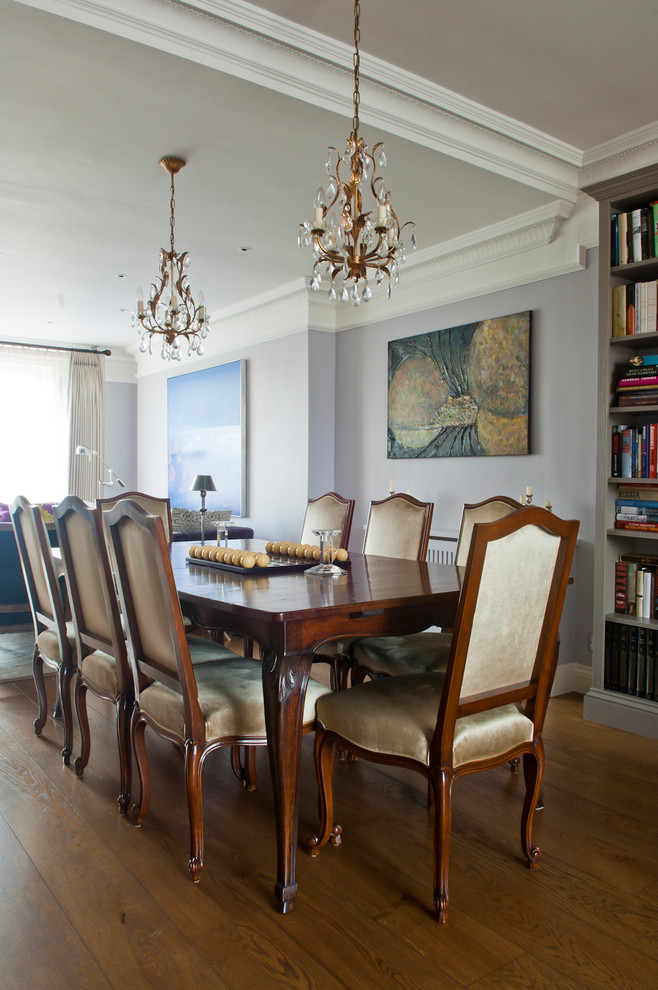 Photo of a mid-sized traditional open plan dining in London with purple walls, dark hardwood floors and brown floor.