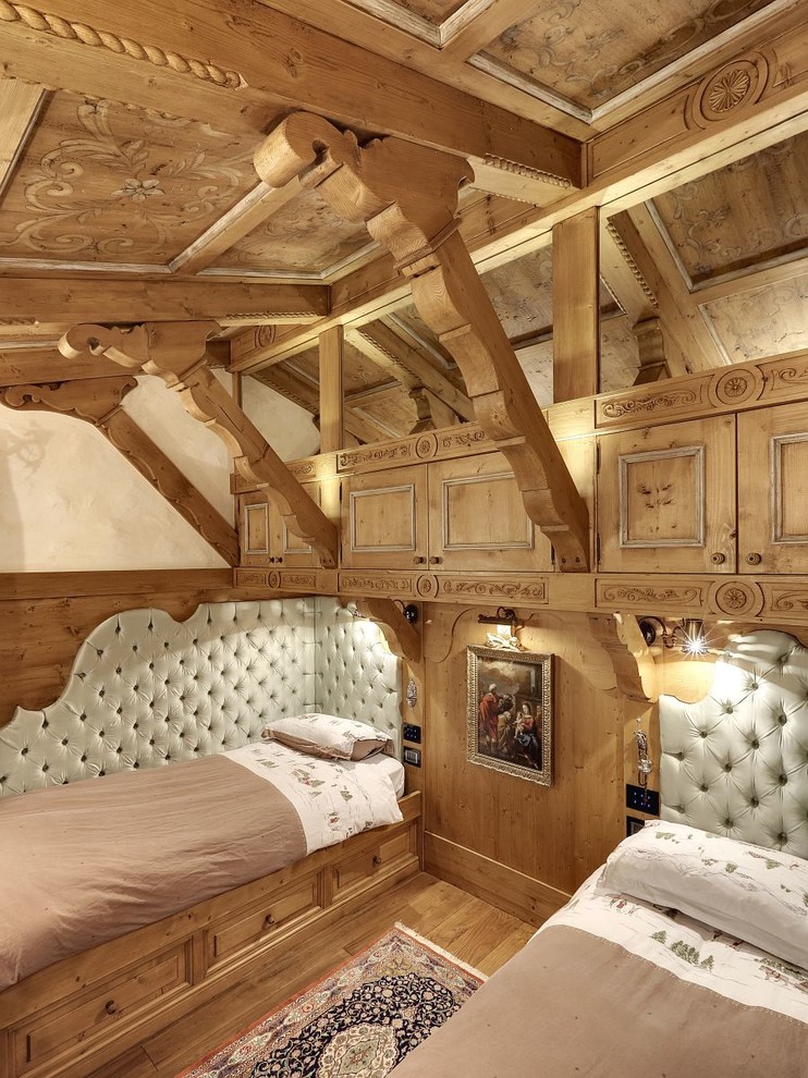 Inspiration for a traditional bedroom in Venice with beige walls and medium hardwood floors.