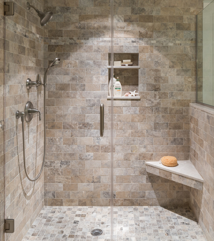 Design ideas for a mid-sized beach style master bathroom in Boston with a corner shower, beige tile, a hinged shower door, travertine, travertine floors and multi-coloured floor.