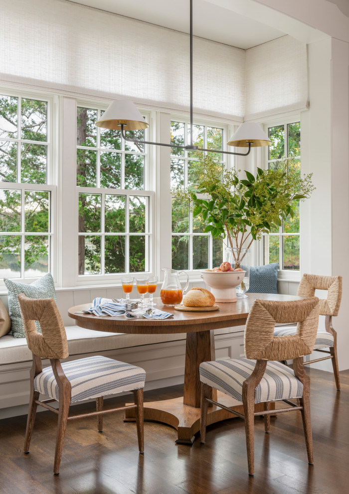 Example of a classic dark wood floor and brown floor breakfast nook design in Boston with white walls