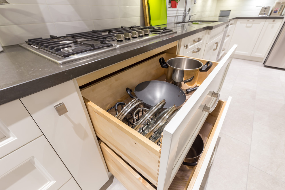 Example of a transitional kitchen design in Toronto