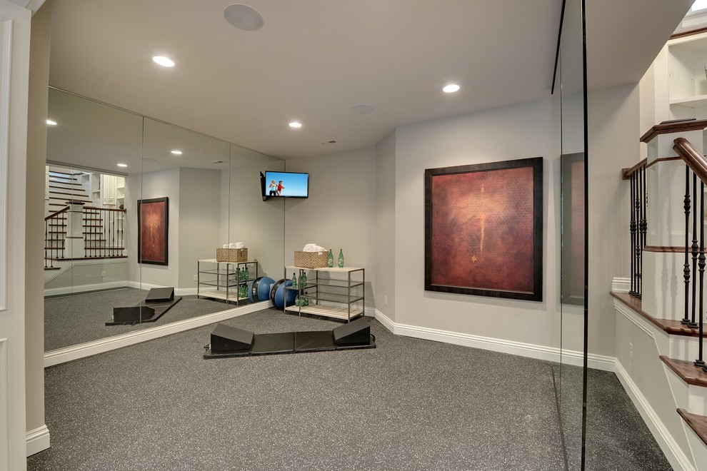 This is an example of a traditional home yoga studio in Minneapolis with grey walls and grey floor.