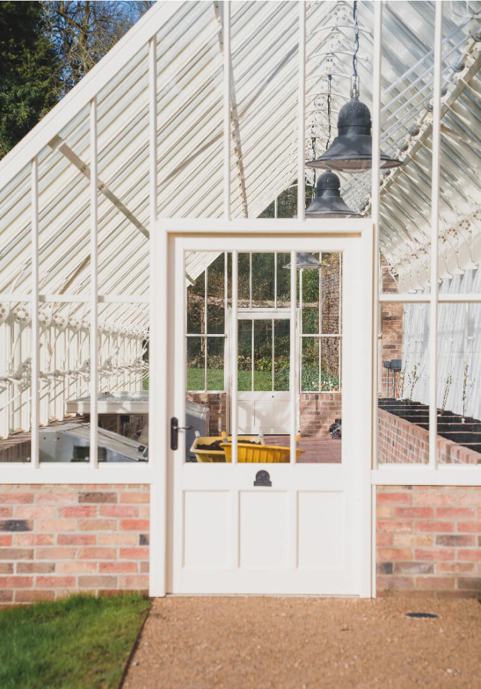 Large victorian attached greenhouse in Other.