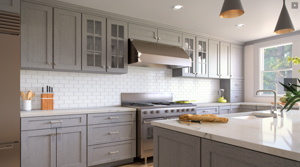 Open concept kitchen - mid-sized transitional l-shaped medium tone wood floor and brown floor open concept kitchen idea in Orlando with an undermount sink, recessed-panel cabinets, gray cabinets, marble countertops, white backsplash, subway tile backsplash, stainless steel appliances, an island and white countertops