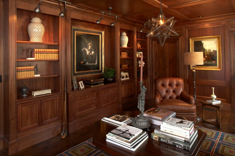 Photo of a traditional home office in Boston with dark hardwood floors.