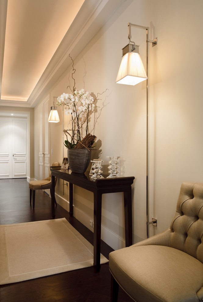 Inspiration for a large transitional hallway in Paris with white walls and dark hardwood floors.