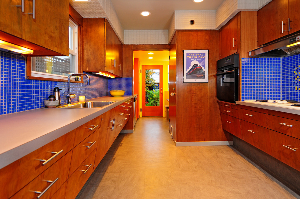 Inspiration for a mid-sized transitional galley linoleum floor eat-in kitchen remodel in Seattle with a single-bowl sink, flat-panel cabinets, medium tone wood cabinets, laminate countertops, blue backsplash, mosaic tile backsplash, black appliances, yellow walls and no island