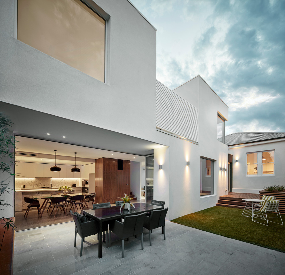 Design ideas for a mid-sized contemporary balcony in Melbourne with a roof extension.