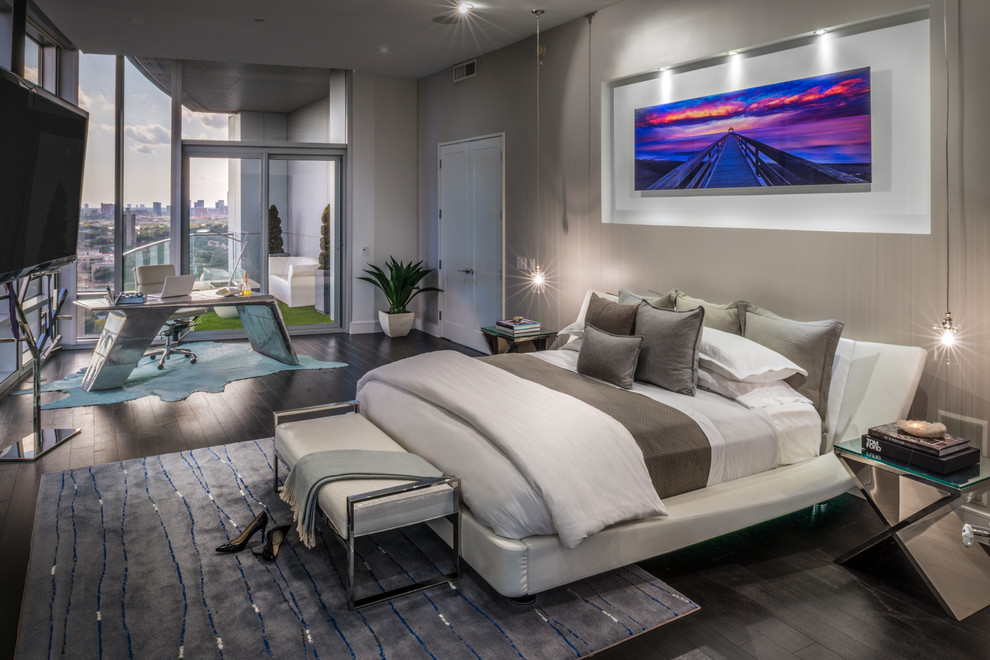 Design ideas for an expansive contemporary master bedroom in Houston with grey walls and dark hardwood floors.