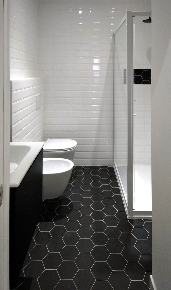 This is an example of a small contemporary 3/4 bathroom in Other with a corner shower, white tile, ceramic tile, white walls, ceramic floors and black floor.