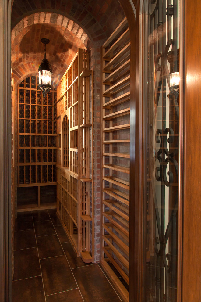 Inspiration for a small traditional wine cellar in Los Angeles with porcelain floors and storage racks.