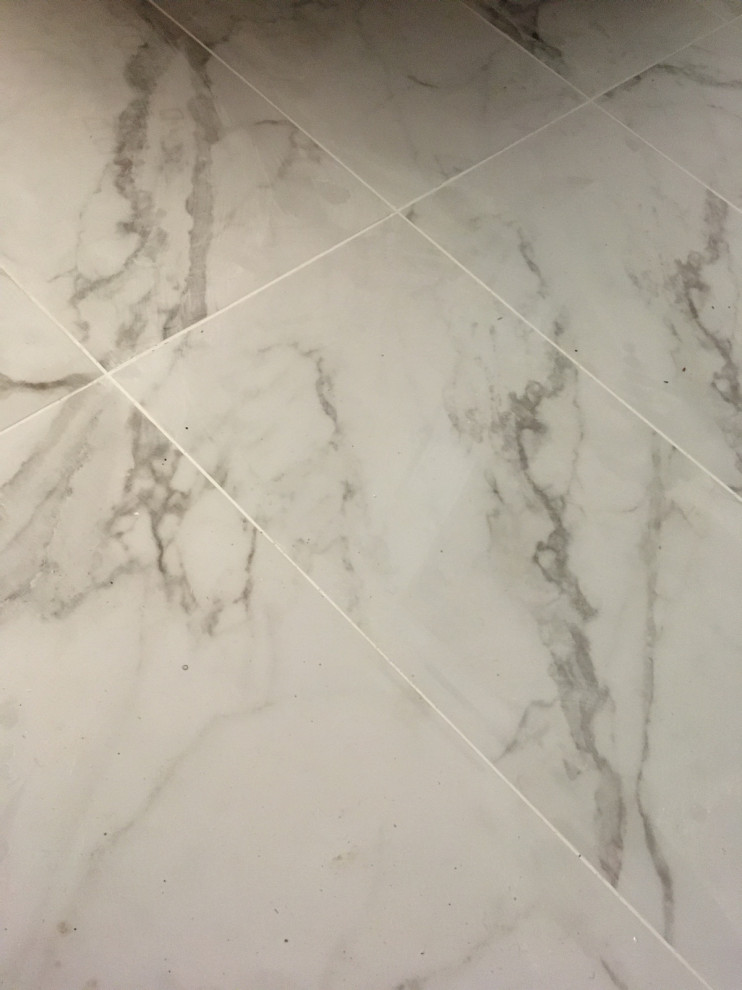 Grout is too white. Can I remove it while still wet?
