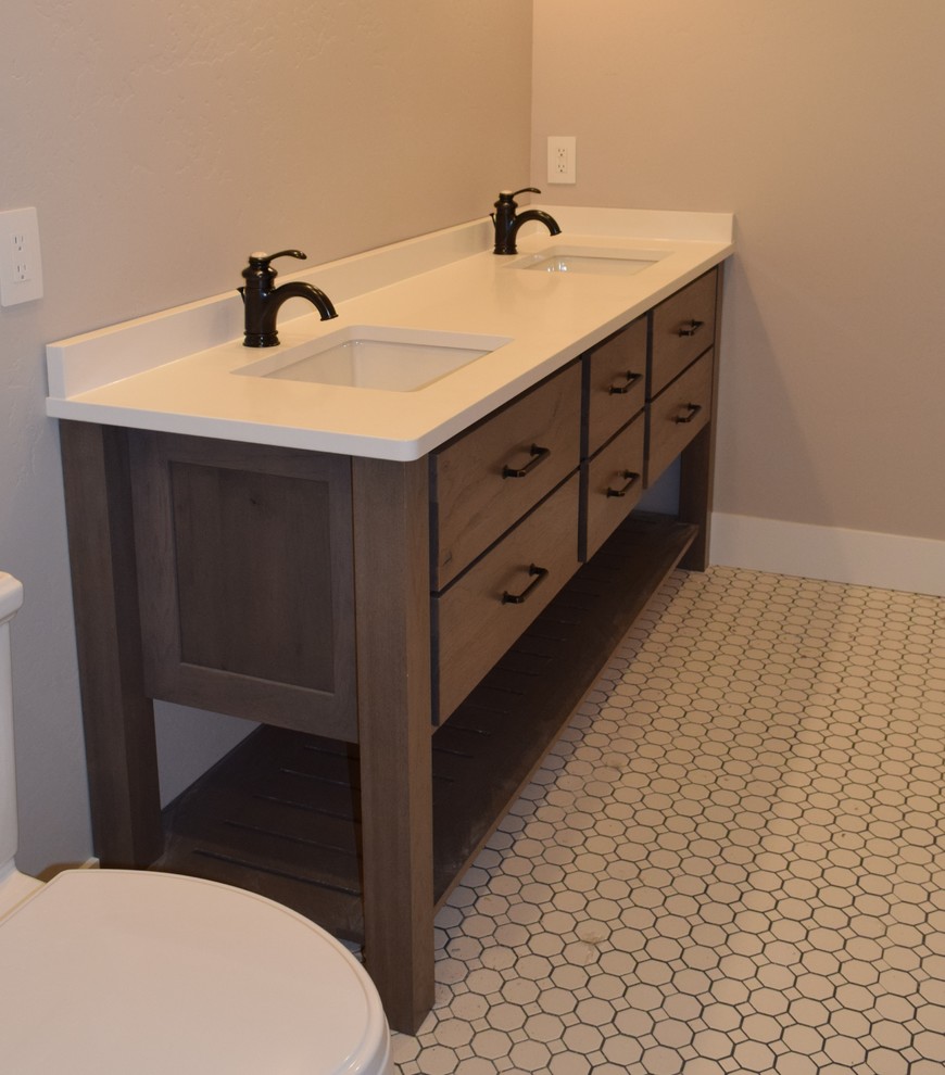 Home design - transitional master mosaic tile floor and white floor home design idea with furniture-like cabinets, medium tone wood cabinets, a one-piece toilet, gray walls, an undermount sink and quartz countertops