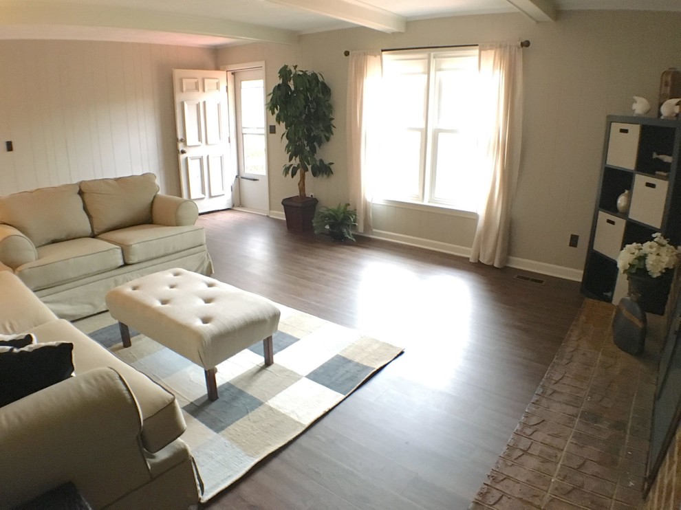 Mid-sized elegant formal and enclosed vinyl floor living room photo in San Diego with beige walls, a standard fireplace, a brick fireplace and no tv