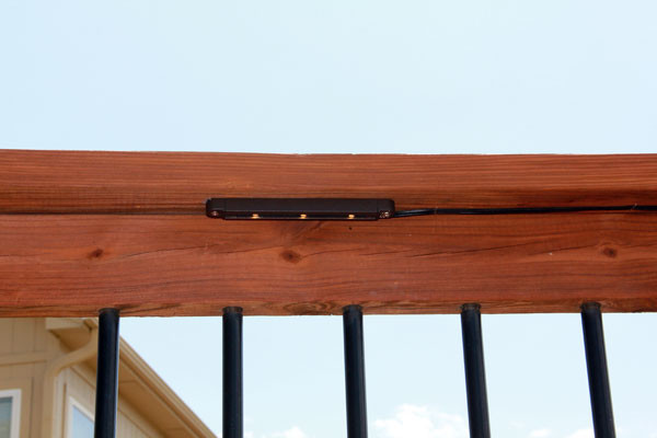 Deck lighting using low under railing LED lights american-traditional-terrace