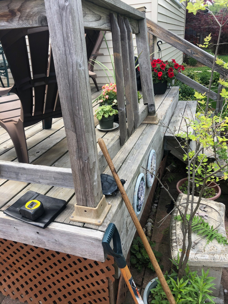 Mid-sized backyard deck photo in Toronto with no cover