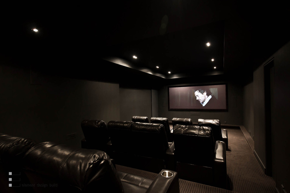 Photo of a modern home theatre in Toronto with black floor.