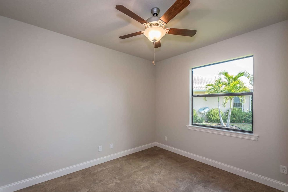 Example of a transitional home design design in Miami