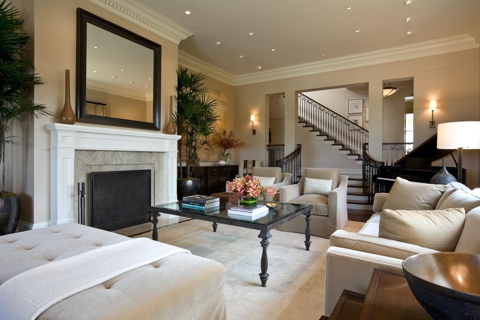 Design ideas for a traditional family room in San Francisco with beige walls and a standard fireplace.