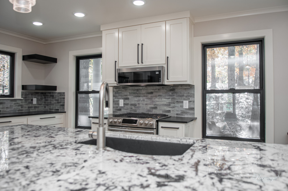 Design ideas for a mid-sized transitional l-shaped open plan kitchen in Other with an undermount sink, recessed-panel cabinets, white cabinets, granite benchtops, stainless steel appliances, vinyl floors, with island and beige floor.