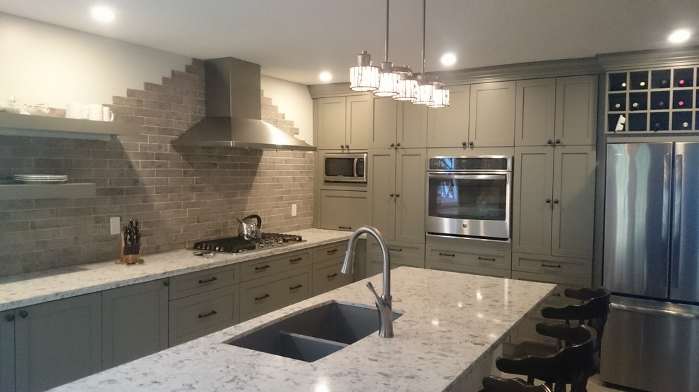 Eat-in kitchen - mid-sized transitional l-shaped porcelain tile eat-in kitchen idea in Toronto with a double-bowl sink, shaker cabinets, gray cabinets, quartz countertops, multicolored backsplash, porcelain backsplash, stainless steel appliances and an island