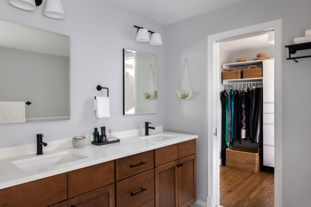 Inspiration for a large transitional master bathroom in DC Metro with shaker cabinets, brown cabinets, a one-piece toilet, gray tile, marble, grey walls, marble floors, an undermount sink, engineered quartz benchtops, grey floor, an open shower, white benchtops, a niche, a double vanity and a built-in vanity.