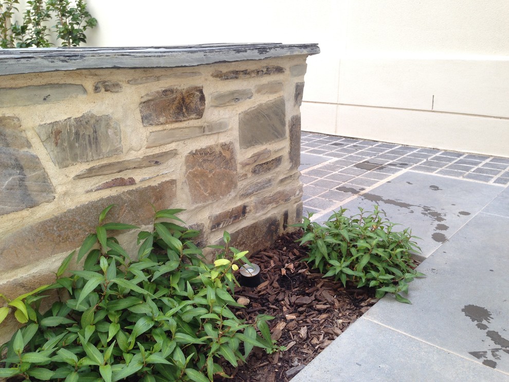 Mid-sized traditional side yard partial sun garden in Adelaide with a vegetable garden and natural stone pavers.