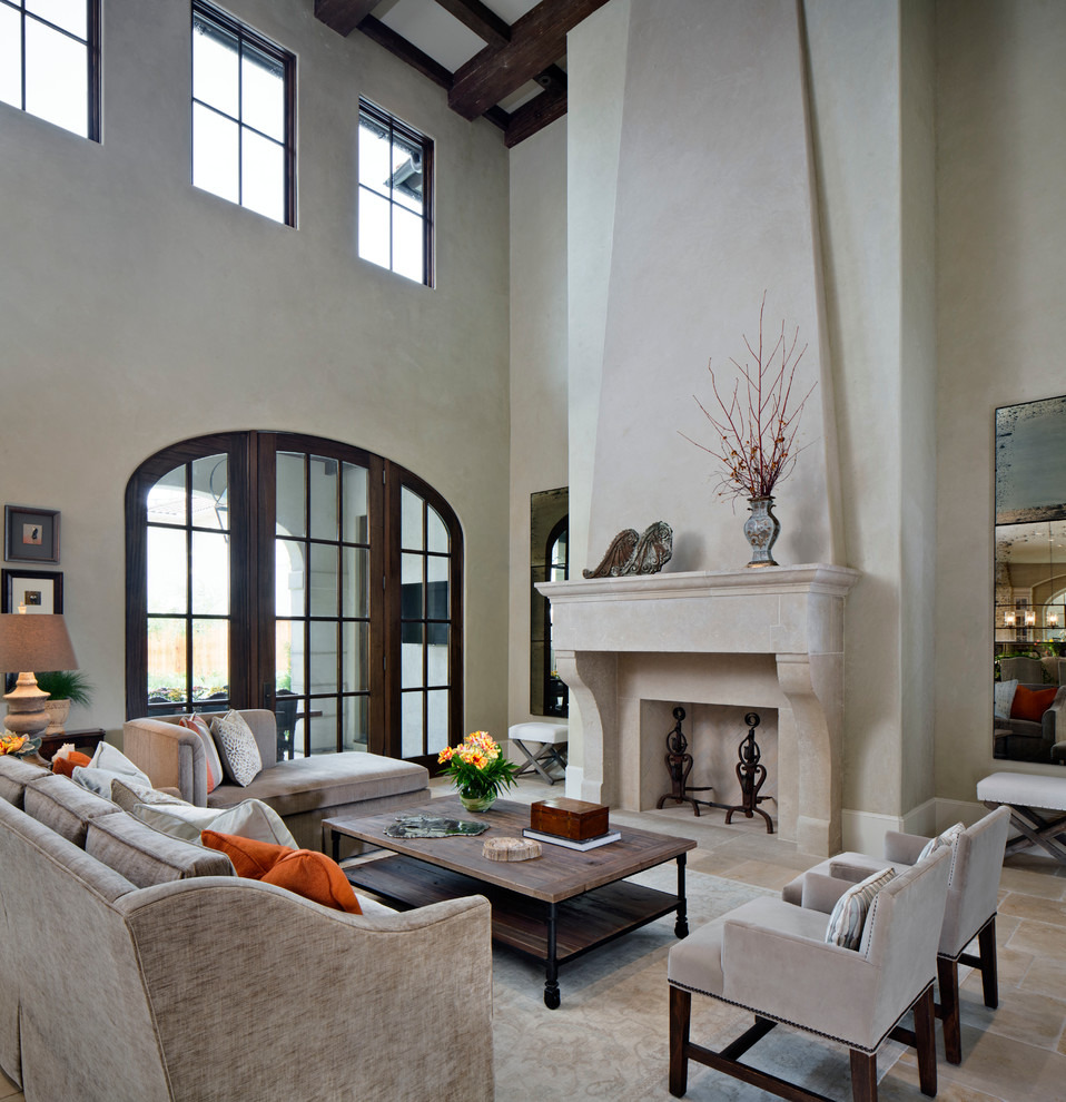 Design ideas for a large mediterranean formal open concept living room in Houston with grey walls, travertine floors, a standard fireplace, a stone fireplace surround and no tv.