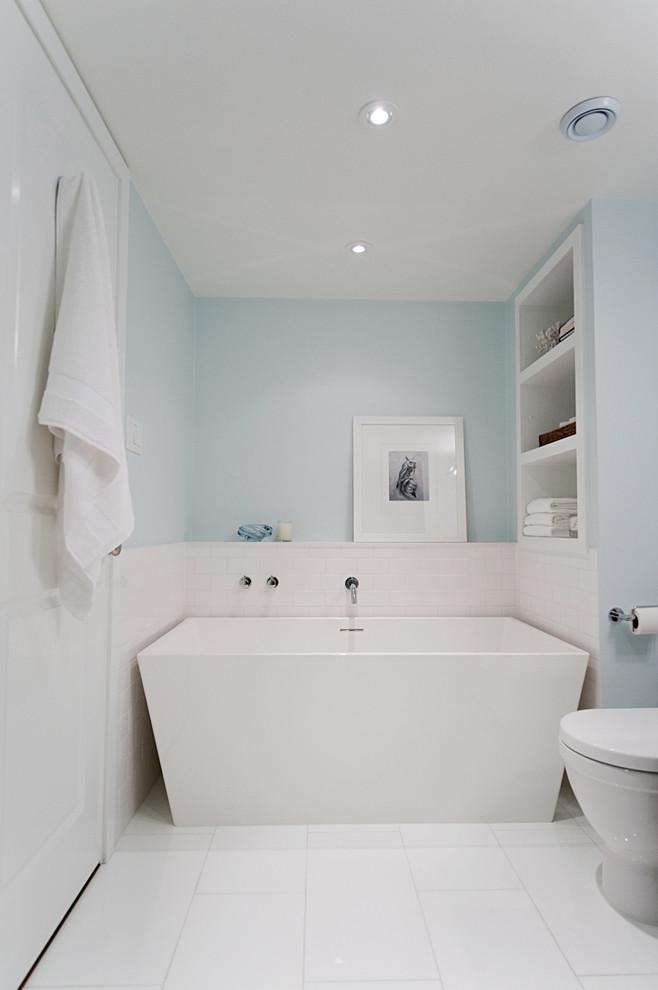 Design ideas for a transitional bathroom in Toronto with a freestanding tub.