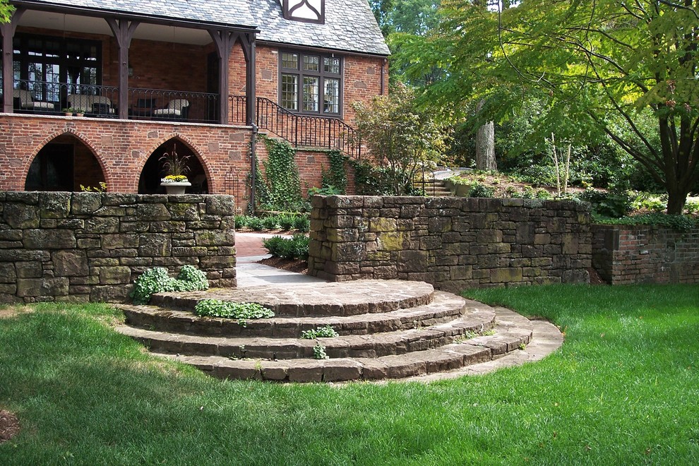 Photo of a large traditional backyard full sun formal garden in Bridgeport with a garden path and natural stone pavers.