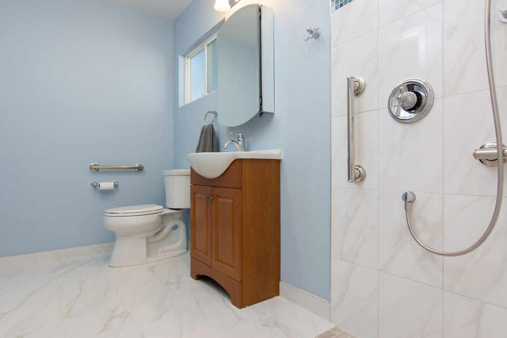 Mid-sized contemporary master bathroom in Los Angeles with an integrated sink, furniture-like cabinets, medium wood cabinets, solid surface benchtops, an open shower, a two-piece toilet, white tile, ceramic tile, blue walls and ceramic floors.