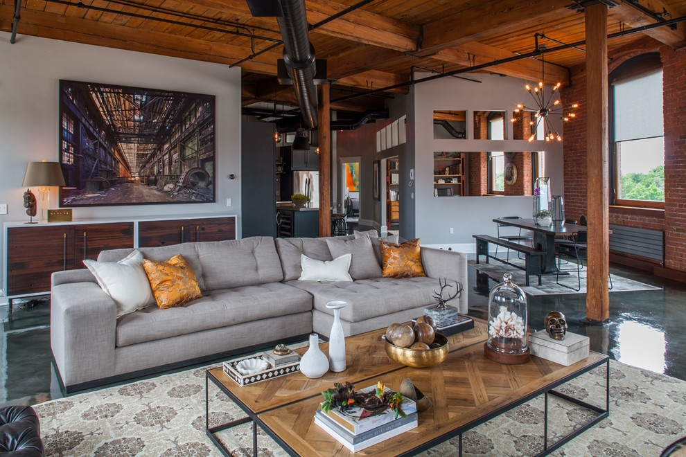 Design ideas for an industrial open concept living room in Providence with grey walls.