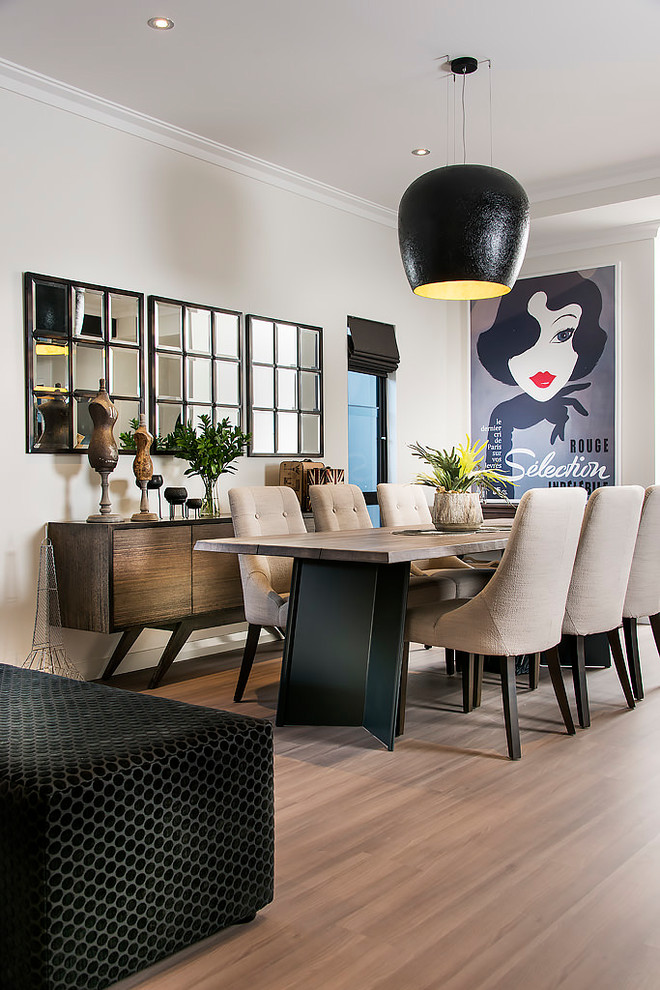 This is an example of a contemporary open plan dining in Perth with grey walls, medium hardwood floors and brown floor.