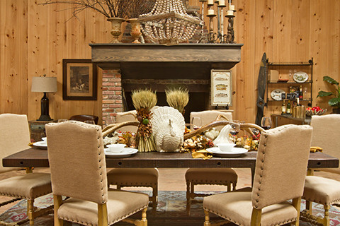 Mountain style light wood floor enclosed dining room photo with beige walls