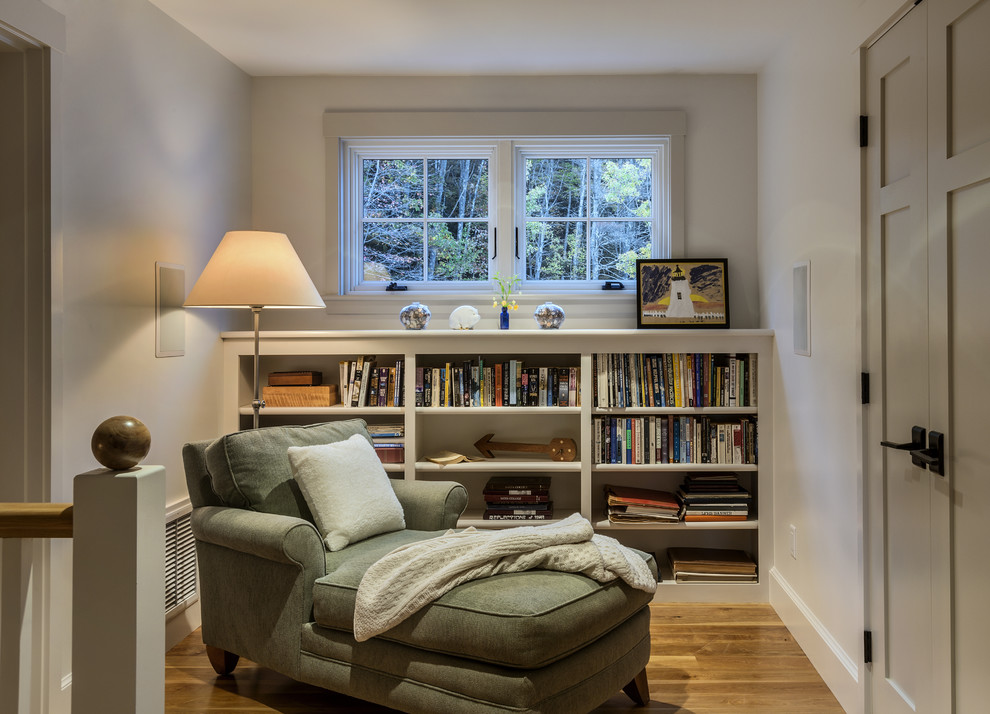 Mid-sized elegant medium tone wood floor hallway photo in Portland Maine with white walls