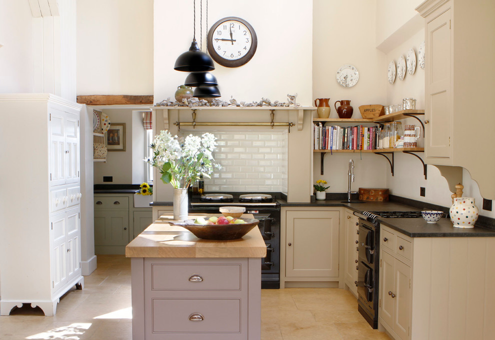 Inspiration for a country kitchen in West Midlands with an integrated sink, shaker cabinets, granite benchtops, white splashback, subway tile splashback and travertine floors.