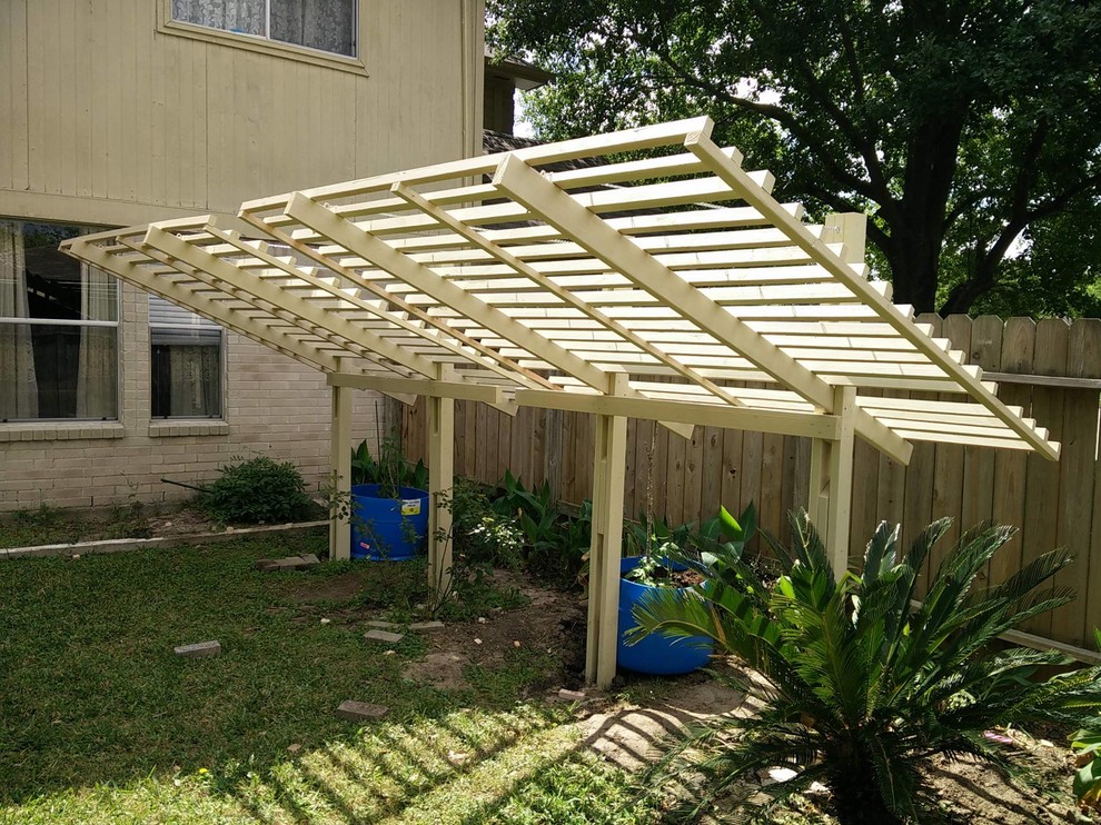 Photo of a mid-sized asian backyard full sun xeriscape for spring in Houston with a vegetable garden and decking.