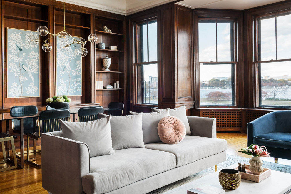 This is an example of a large classic open plan living room in Boston.