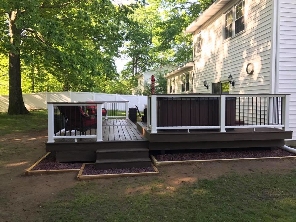 Mid-sized backyard deck photo with no cover