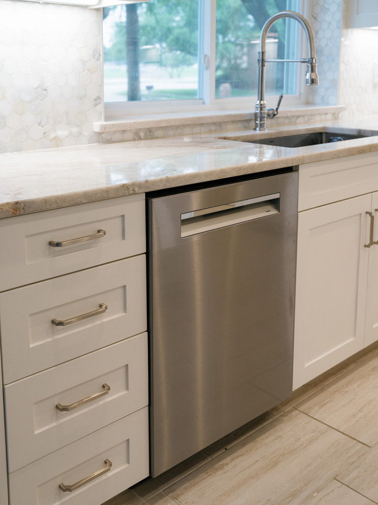 Enclosed kitchen - large transitional u-shaped medium tone wood floor and brown floor enclosed kitchen idea in Dallas with an undermount sink, raised-panel cabinets, beige cabinets, quartzite countertops, white backsplash, marble backsplash, stainless steel appliances, an island and beige countertops
