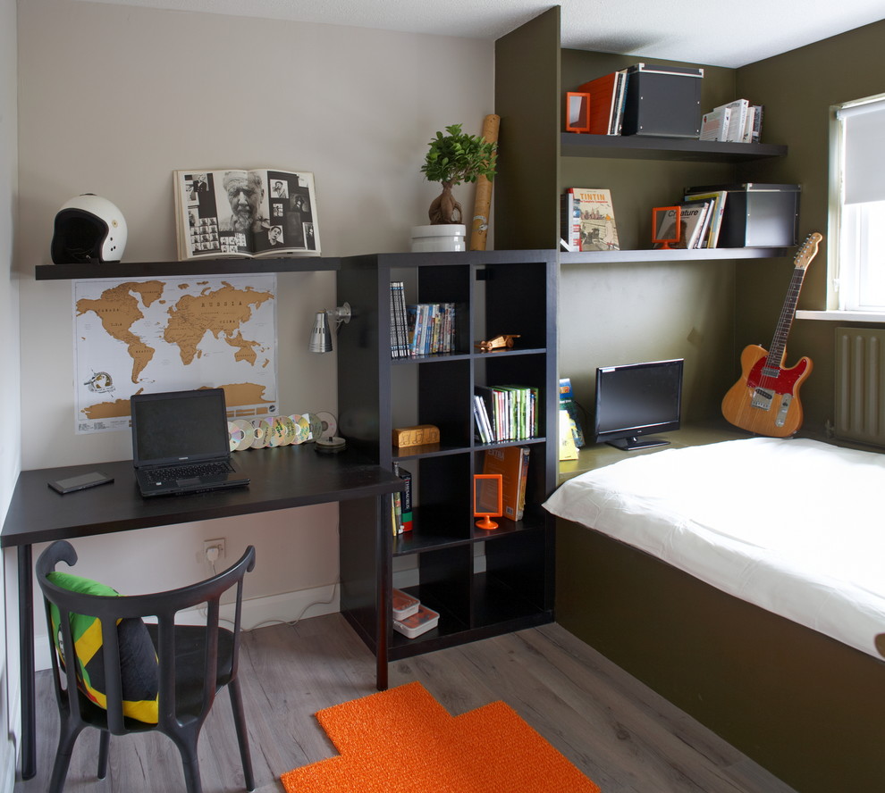 Photo of a contemporary kids' room for boys in Dublin with grey walls and medium hardwood floors.