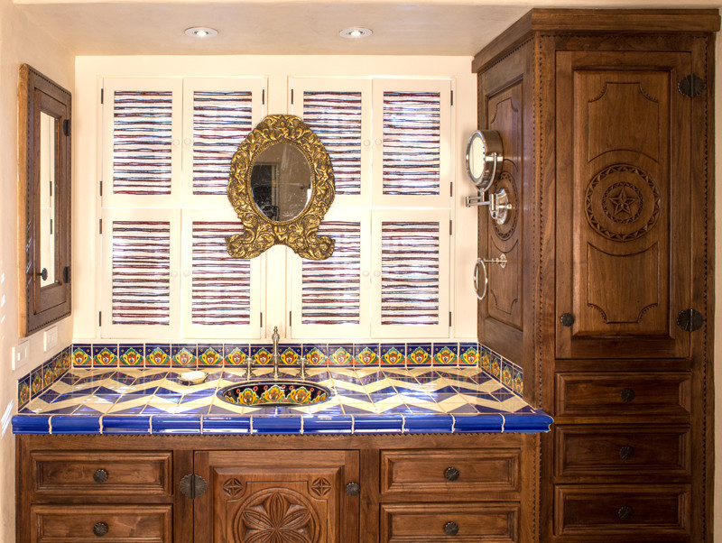 Inspiration for a small country 3/4 bathroom in Albuquerque with furniture-like cabinets, medium wood cabinets, tile benchtops, multi-coloured tile and terra-cotta tile.