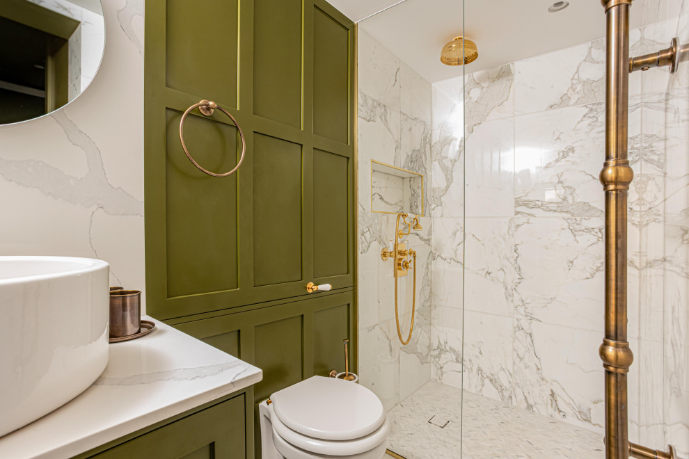 Inspiration for a large contemporary master bathroom in London with shaker cabinets, green cabinets, an open shower, a wall-mount toilet, white tile, marble, green walls, marble floors, a vessel sink, marble benchtops, white floor, an open shower, white benchtops, a single vanity, a built-in vanity and panelled walls.