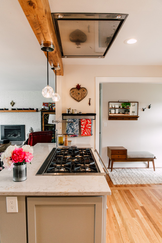 Small contemporary u-shaped eat-in kitchen in Seattle with a farmhouse sink, shaker cabinets, grey cabinets, quartz benchtops, white splashback, brick splashback, coloured appliances, medium hardwood floors, a peninsula, brown floor and yellow benchtop.