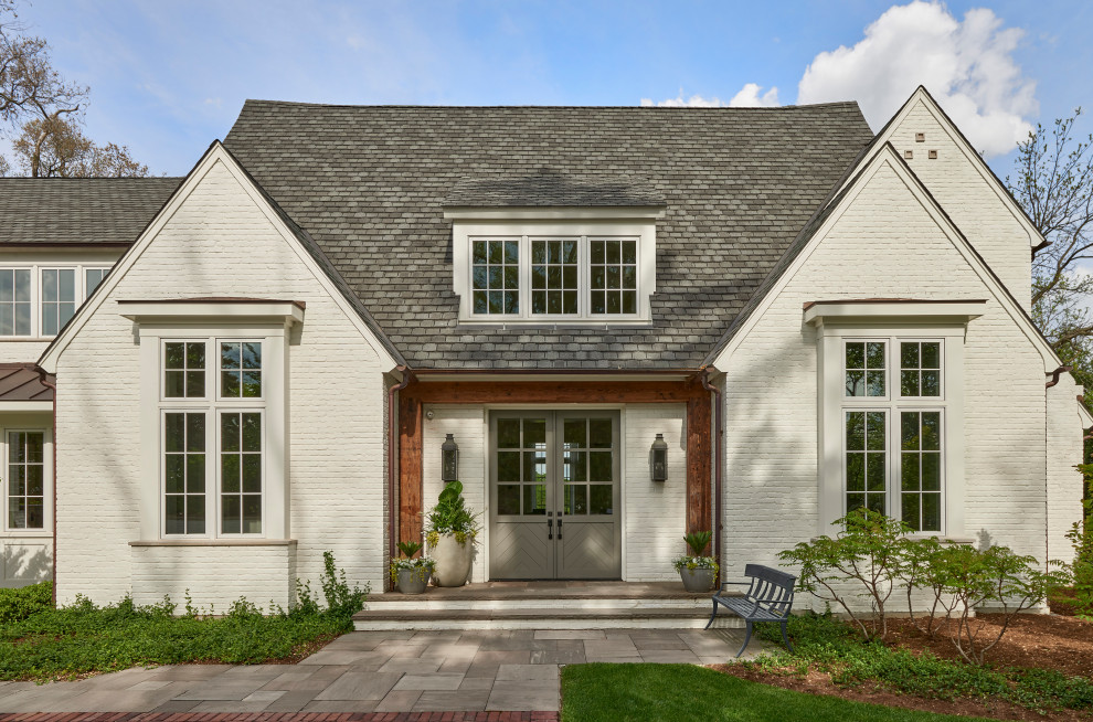 White two-story painted brick exterior home idea in Chicago with a shingle roof and a gray roof
