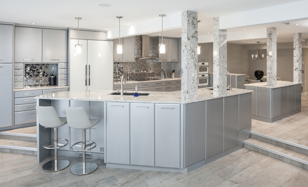 This is an example of a large modern single-wall eat-in kitchen in Calgary with an undermount sink, flat-panel cabinets, grey cabinets, quartz benchtops, metallic splashback, white appliances, multiple islands, grey floor and multi-coloured benchtop.