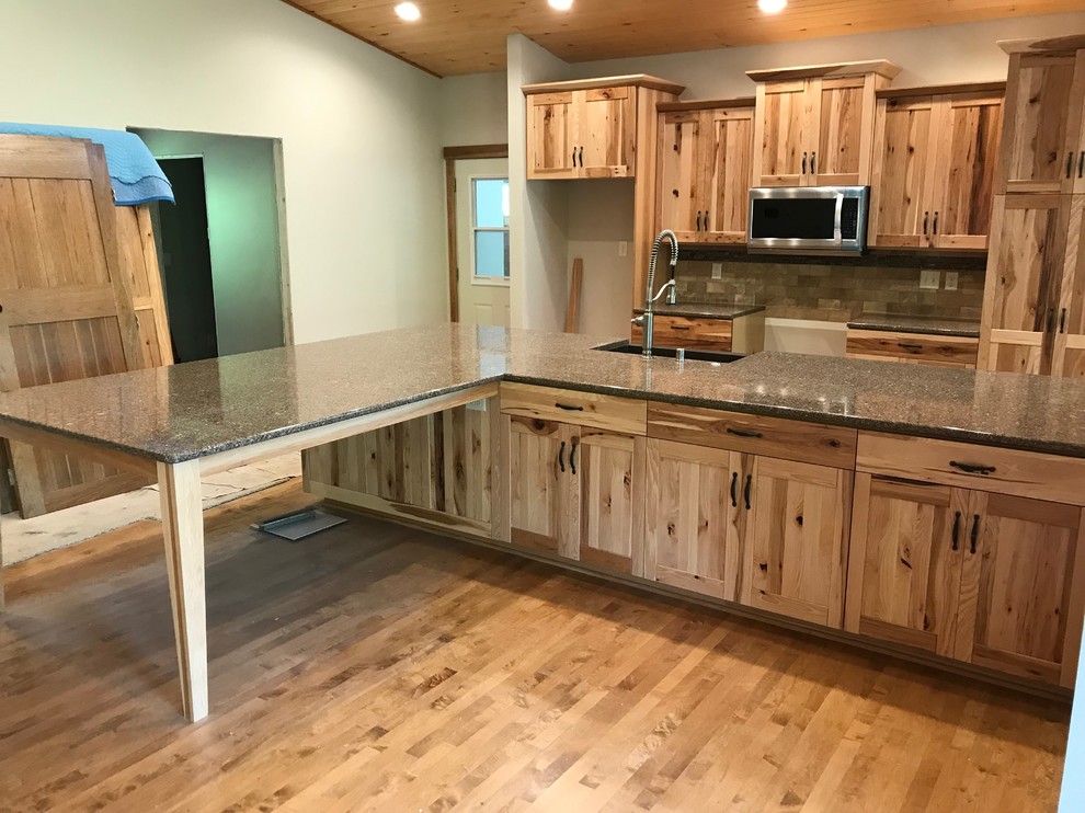 Mid-sized mountain style galley eat-in kitchen photo with an island